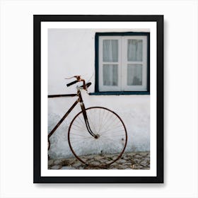 The Bike Against A White Wall In Small Village In Portugal Art Print