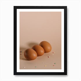 Three Brown Eggs On A Beige Background Art Print