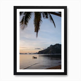 Boat on the water at sunset with palms Art Print