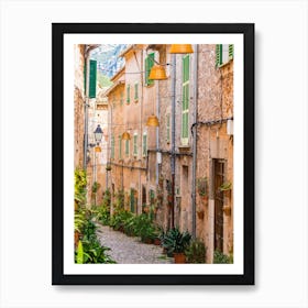 Mallorca Spain. Beautiful view of idyllic street in Valldemossa village on Mallorca island, Spain. Experience the charm and beauty of Valldemossa village on Mallorca island with its idyllic streets and picturesque buildings. Art Print
