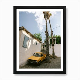 Yellow Car Parked between the palm trees Art Print