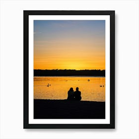 Beach At Sunrise Silhouetted Figure Meditating By The Shore Warm Glow Of Morning Light Reflecting Art Print