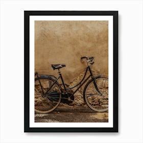 Old Bicycle Against A Wall Art Print