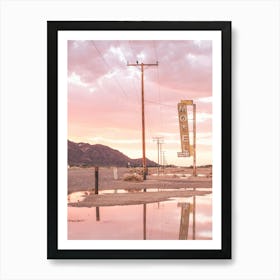 Route 66, USA I Sunset in front of a vintage retro motel neon sign in a California desert landscape to pastel pink sky sun aesthetic and a mirrored reflection in water photography in front of the Bagdad Cafe Art Print