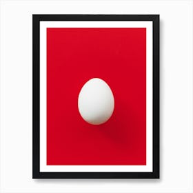 White Egg On Red Background Póster