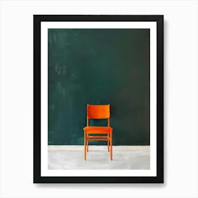 Orange Chair In Front Of A Blackboard Art Print