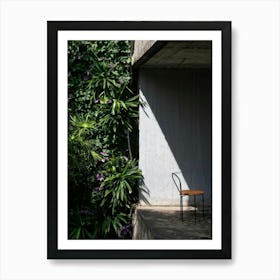 Two Chairs In Front Of A Wall Art Print