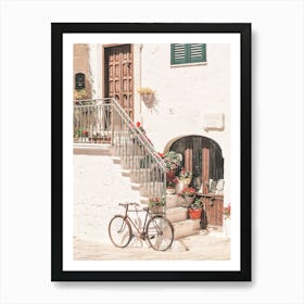 Puglia, Italy I Bicycle in front of flower house in white village of Ostuni in Italian countryside authentic retro vintage minimalist aesthetic photography in pastel Mediterranean summer colors during sunrise Art Print