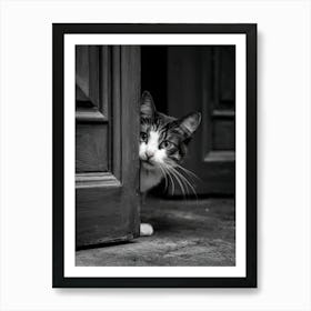 Cat Peeking Out Of The Door Art Print