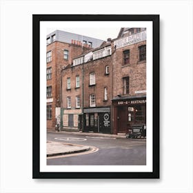 London, England I Street with brick architecture facades in Londoner vintage district of Spitafields from a retro UK urban landscape to the dark moody aesthetic of an analog film photography Art Print