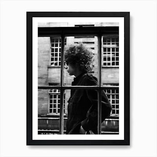 American Singer Bob Dylan Pictured Walking Past A Shop Window During His Visit To London Art Print