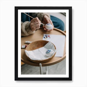 Woman Paints On A Table Art Print