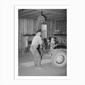 Garage Owner Hoisting Car So That He Can Make Repairs, Pie Town, New Mexico By Russell Lee Art Print