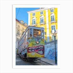 Bright yellow cable car with graffiti in Lisbon, Portugal - summer street and travel photography by Christa Stroo Photography Art Print