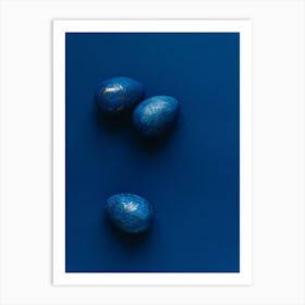 Three Blue Eggs On A Blue Surface Art Print