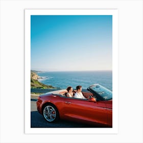 Couple Basks In Golden Hour Glow As They Drive A Vibrant Red Convertible Down A Coastal Highway Cli (4) Art Print