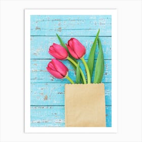 Tulips In A Paper Bag On A Wooden Background Art Print