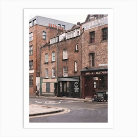 London, England I Street with brick architecture facades in Londoner vintage district of Spitafields from a retro UK urban landscape to the dark moody aesthetic of an analog film photography Art Print