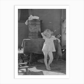 Child Of Migrant Family In Front Of Household Goods Of Trailer Home, Weslaco, Texas By Russell Lee Art Print