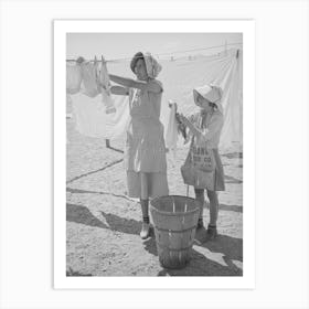 Wife Of Migratory Agricultural Laborer And Daughter Hanging Up The Wash At The Agua Fria Migratory Labor Camp Art Print