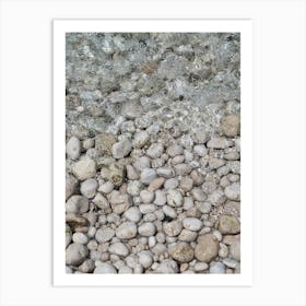 White stones and clear water on the beach Art Print