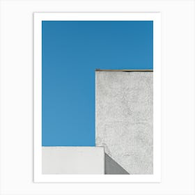 White Building Against A Blue Sky Art Print