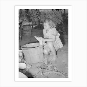 Daughter Of Migrant Family Wiping And Packing Dishes Preparatory To Leaving For California From Muskogee, Oklahoma Art Print