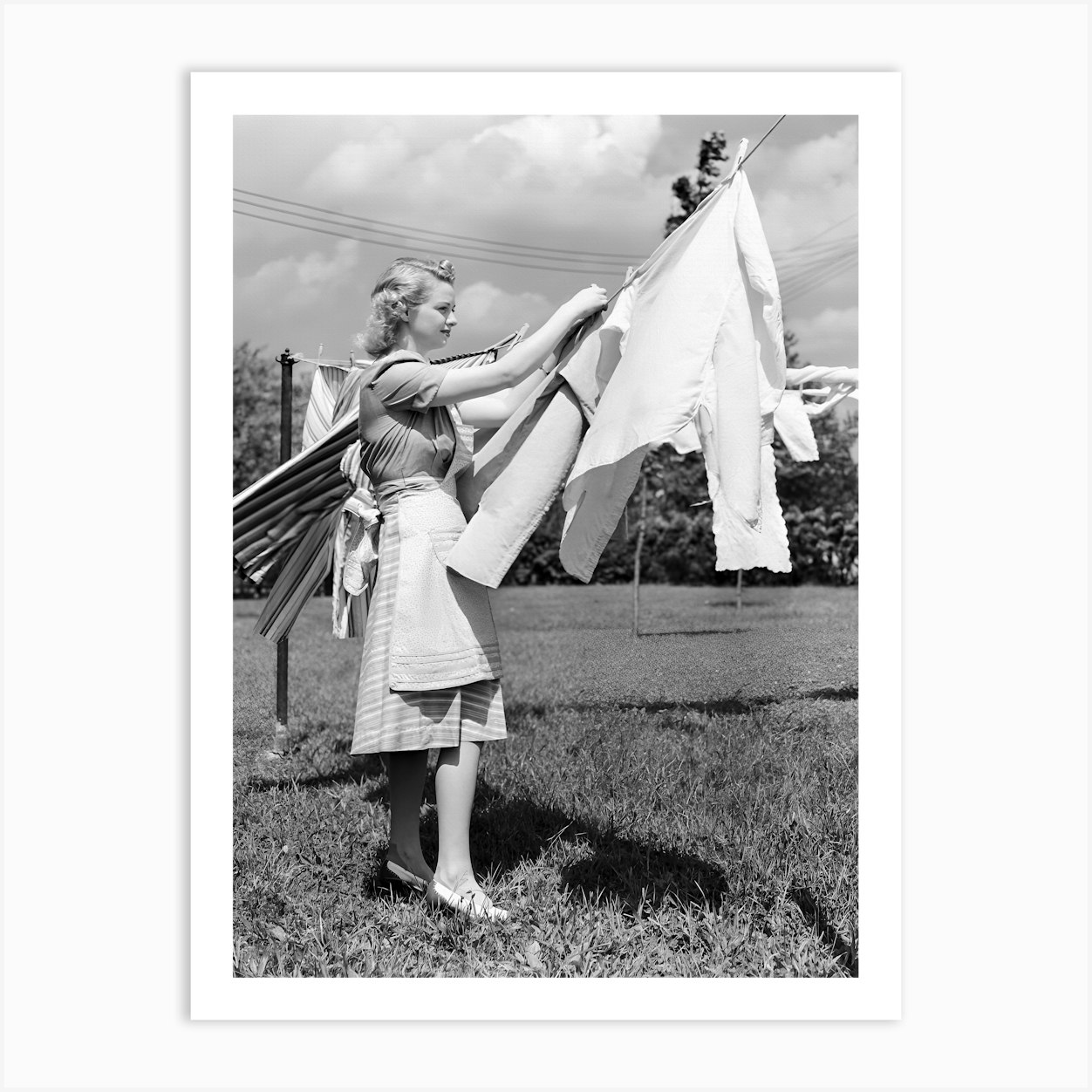 Woman Drying Clothes on Laundry Line, Vintage Black and White Old Photo Art Print by Vibrant Vintage