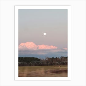 Moon in the sunset clouds Art Print