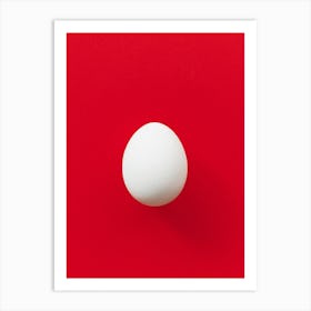 White Egg On Red Background Art Print