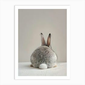 Grey Rabbit Sitting On A Table Poster