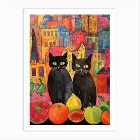 Two Black Cats With Colourful Fruit In Front Of A City Scape Art Print