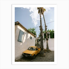 Yellow Car Parked between the palm trees Art Print