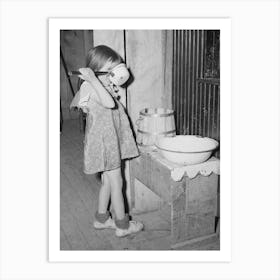 Josie, Daughter Of Faro Caudill, Drinking Water In Front Of Washstand, Pie Town, New Mexico By Russell Lee Art Print