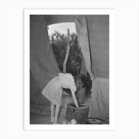 Child Of White Migrant Worker Building Fire In Heating Stove In Tent Home, Harlingen, Texas By Russell Lee Art Print