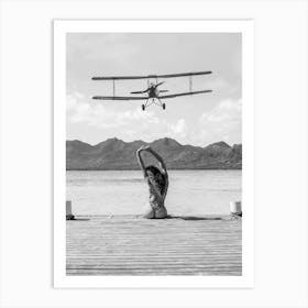 Woman on a Dock - Aircraft Coming In For An Island Landing Art Print