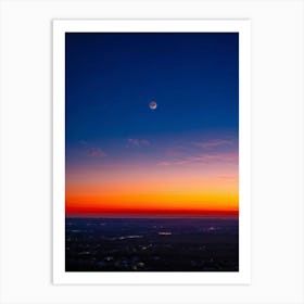 A Sweeping Panorama Of An Evening Sky Blood Red With The Setting Sun Transitions Into A Serene Moon (1) Art Print