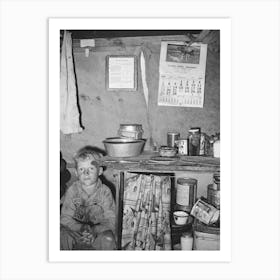Child Of Migrant Sitting By Kitchen Cabinet In Tent Home Near Edinburg, Texas By Russell Lee Art Print