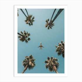 Airplane Flying Over Palm Trees Art Print