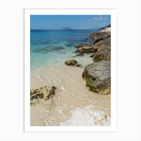 Clear sea water and rocks in a bay Art Print