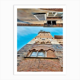 Lucca Guinigi Tower and Its Rooftop Trees. The Guinigi Tower, a historic landmark in Lucca, Italy, stands out for its unique rooftop garden featuring tall oak trees. Built in the 14th century, the red-brick structure embodies medieval architecture and offers panoramic views of the city for visitors who climb to the top. Art Print