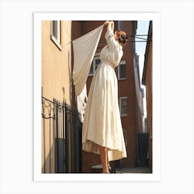 A woman hangs laundry Art Print