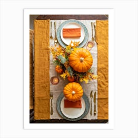 Autumn Themed Dinner Table Centerpiece Of Intertwined Golden Orange Pumpkin Vines Scattered Leaves (2) Art Print