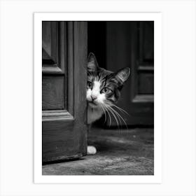 Cat Peeking Out Of The Door Art Print