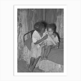 New Madrid County, Missouri, Child Of Sharecropper Wiping Baby S Nose In Cabin By Russell Lee Art Print