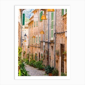 Mallorca Spain. Beautiful view of idyllic street in Valldemossa village on Mallorca island, Spain. Experience the charm and beauty of Valldemossa village on Mallorca island with its idyllic streets and picturesque buildings. Art Print