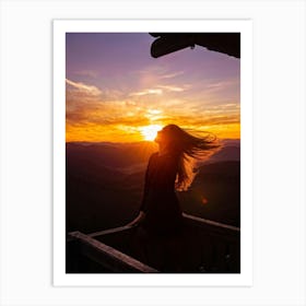 Woman Basking In Sunsets Glow On A Mountain Porch Silhouette Against A Sky Painted With Hues Of Or (3) Art Print