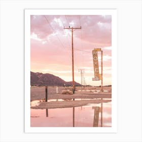 Route 66, USA I Sunset in front of a vintage retro motel neon sign in a California desert landscape to pastel pink sky sun aesthetic and a mirrored reflection in water photography in front of the Bagdad Cafe Art Print