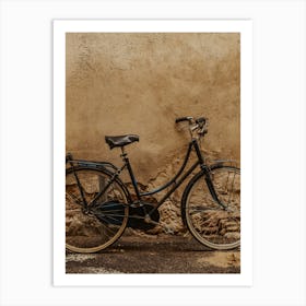 Old Bicycle Against A Wall Art Print