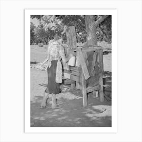 Mrs, Faro Caudill Placing Milk Into Homemade Cooling Box, Damp Cloths Are Wrapped Around Buckets And Jars Of Art Print